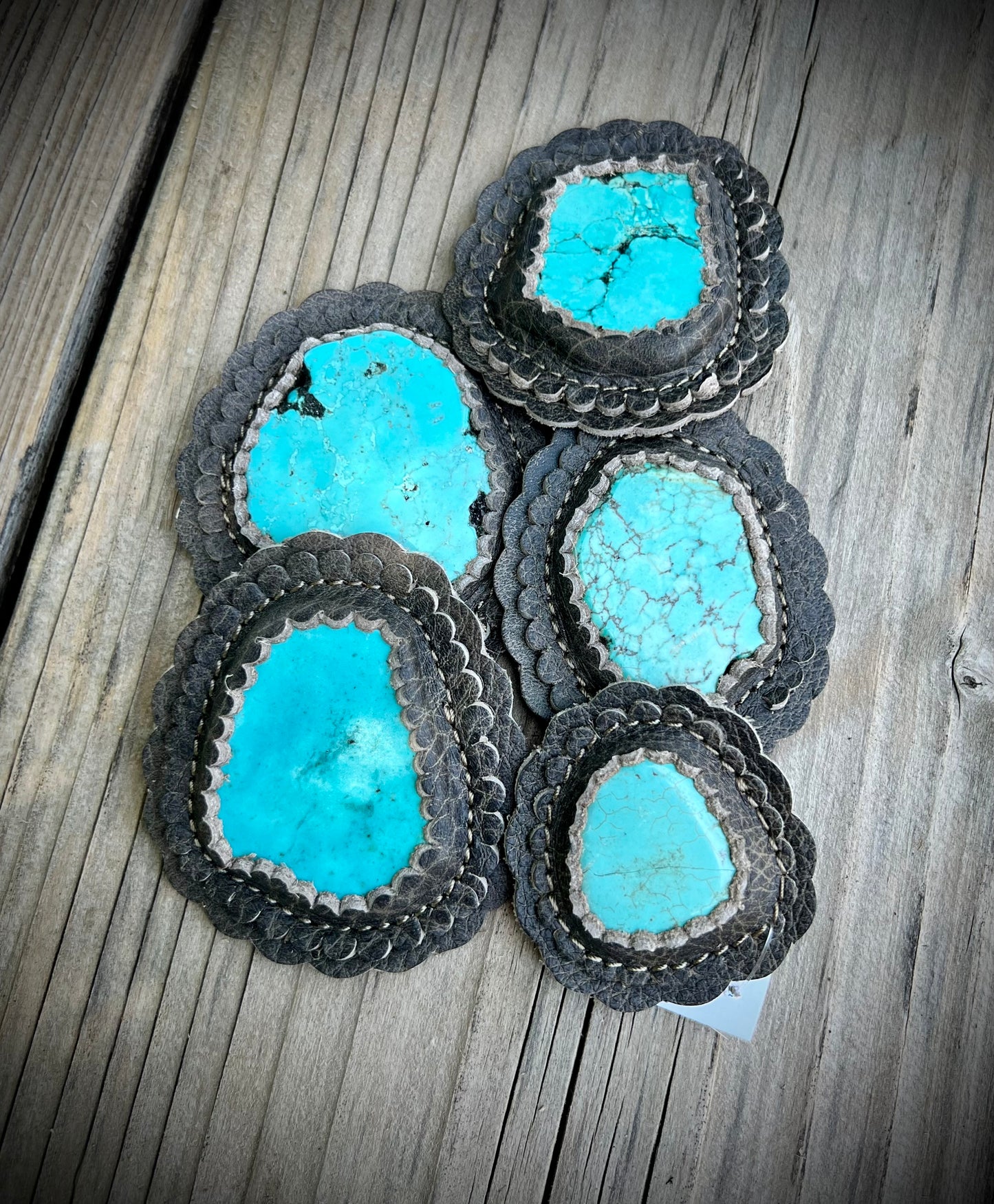 Turquoise cabochons in granite