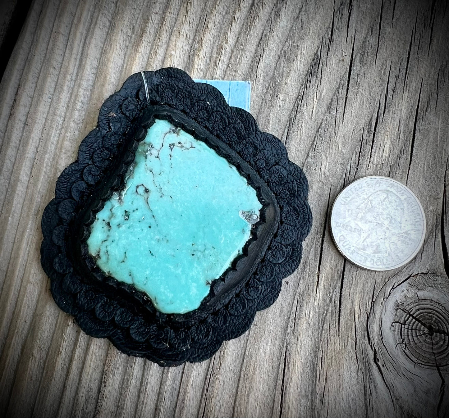 Turquoise in black leather
